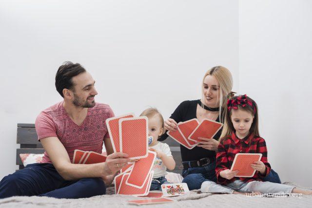 father-playing-cards-with-family